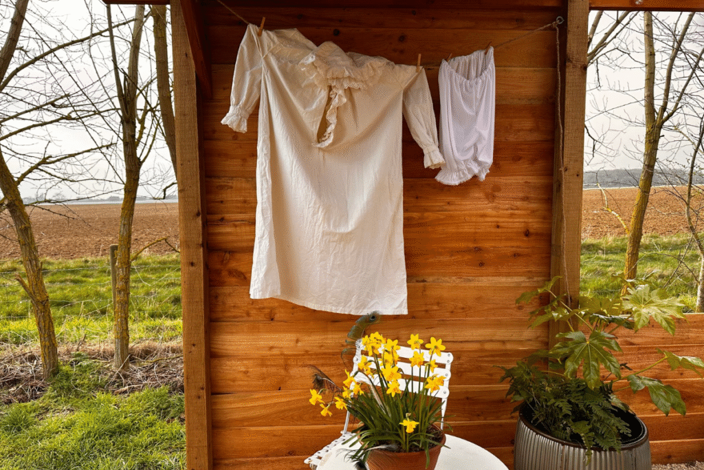 old fashioned night wear hanging in the bath house